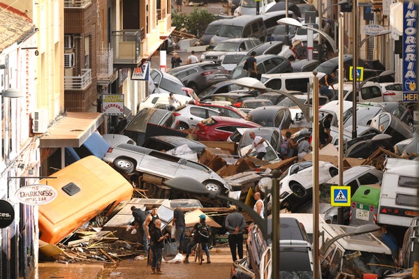 Cars piled in the street after flash flood