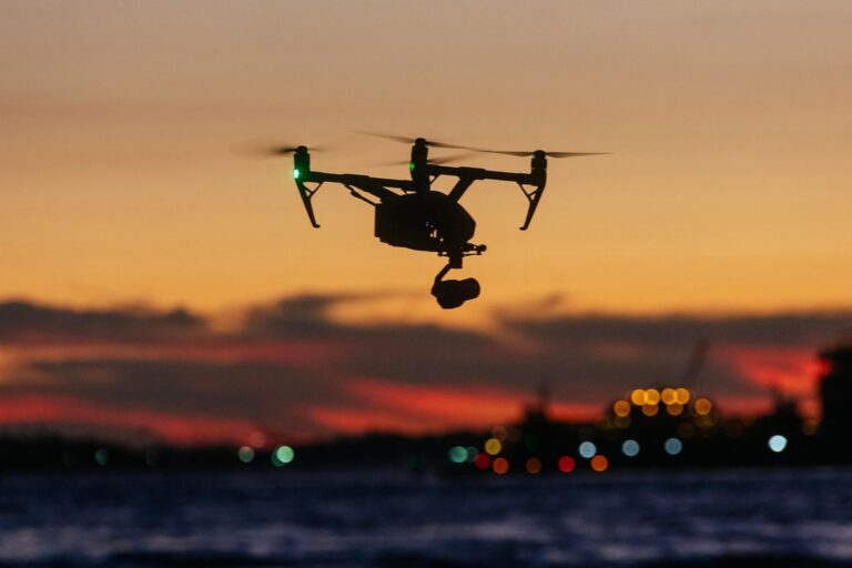 drone flying nyc skyline at sunset